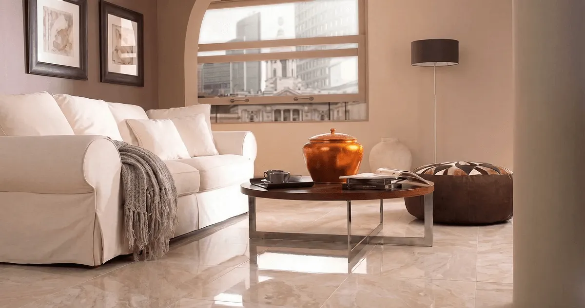 Modern living room with professionally installed marble flooring, a beige sofa, coffee table in Chandler, AZ